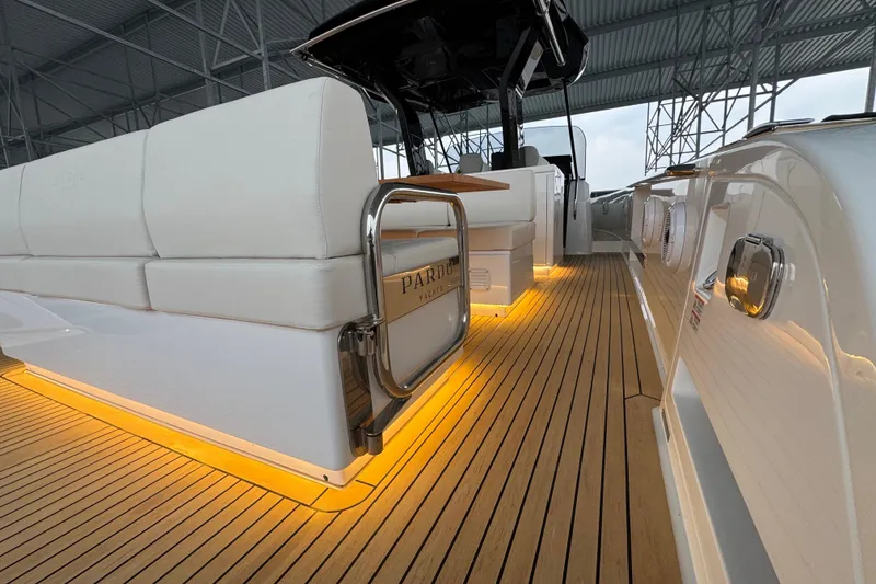 Slide: The Image of 2025 Pardo Yachts P38 with illuminated deck and luxurious seating under a covered area. - 6