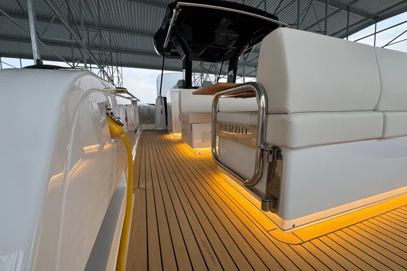 Slide: The Image of 2025 Pardo Yachts P38 interior with elegant lighting and sleek design under a canopy. - 7