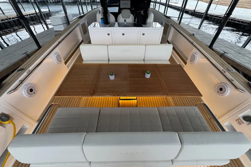 Slide: The Image of Luxurious 2025 Pardo Yachts P38 interior with elegant seating and wooden table. - 8