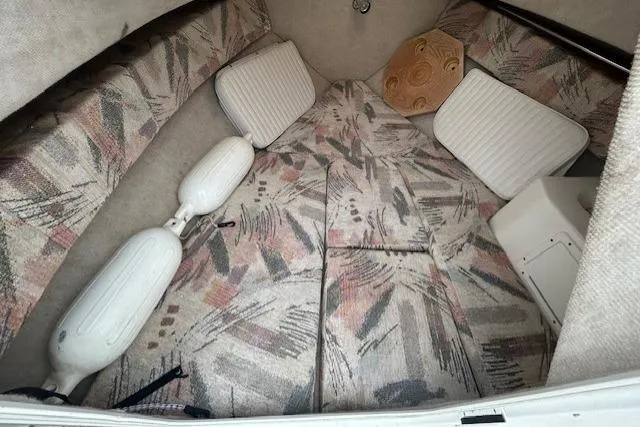 Slide: The Image of 2005 Sea Fox 230 Walk Around boat with black canvas cover and bimini top. - 13