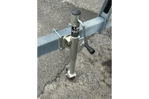 Slide: The Image of 2005 Sea Fox 230 Walk Around cabin interior with patterned upholstery and cushions. - 19