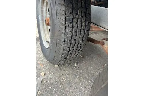 Slide: The Image of Close-up of a trailer tire for a 2005 Sea Fox 230 Walk Around boat. - 22