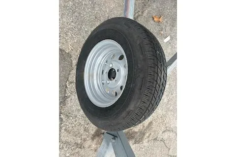 Slide: The Image of Trailer tire on pavement, related to 2005 Sea Fox 230 Walk Around boat. - 23