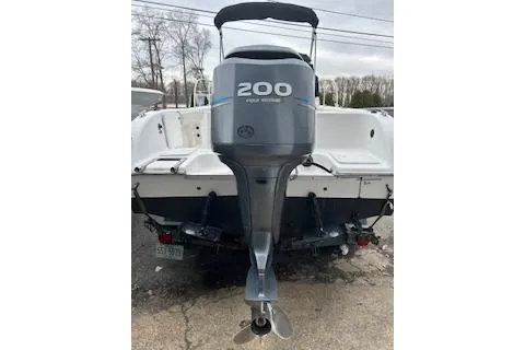 Slide: The Image of 2005 Sea Fox 230 Walk Around boat on trailer, parked outdoors. - 4