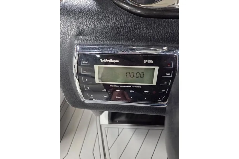 Slide: The Image of Rockford Fosgate media player in 2013 Malibu Wakesetter 22 MXZ boat dashboard. - 10