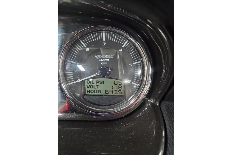 Slide: The Image of Close-up of 2013 Malibu Wakesetter 22 MXZ gauge showing oil PSI, voltage, and hours. - 13