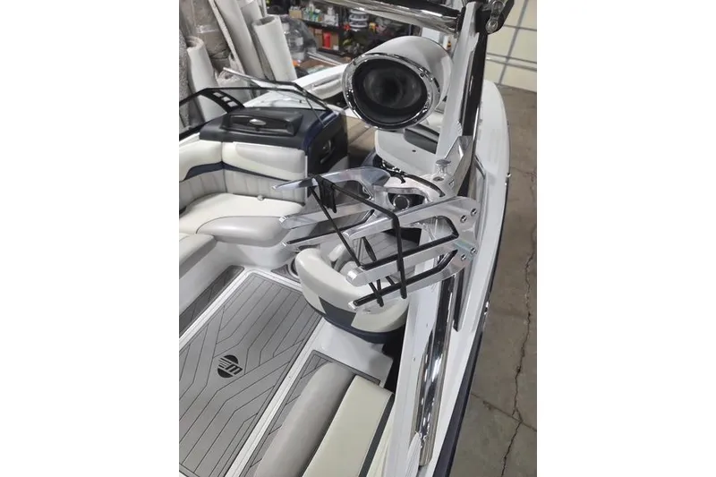 Slide: The Image of 2013 Malibu Wakesetter 22 MXZ interior with sleek seating and wakeboard rack. - 18