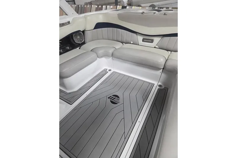 Slide: The Image of 2013 Malibu Wakesetter 22 MXZ interior with gray seating and custom flooring. - 21