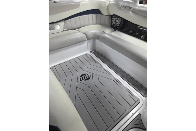Slide: The Image of 2013 Malibu Wakesetter 22 MXZ interior with sleek seating and custom flooring. - 23