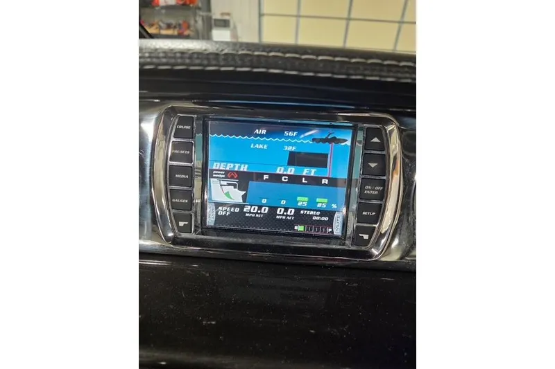 Slide: The Image of Dashboard display of a 2013 Malibu Wakesetter 22 MXZ boat showing depth and speed. - 8