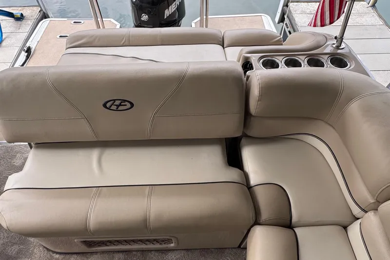 Slide: The Image of Luxurious seating on a 2010 Harris Grand Mariner 250 pontoon boat with cup holders. - 19