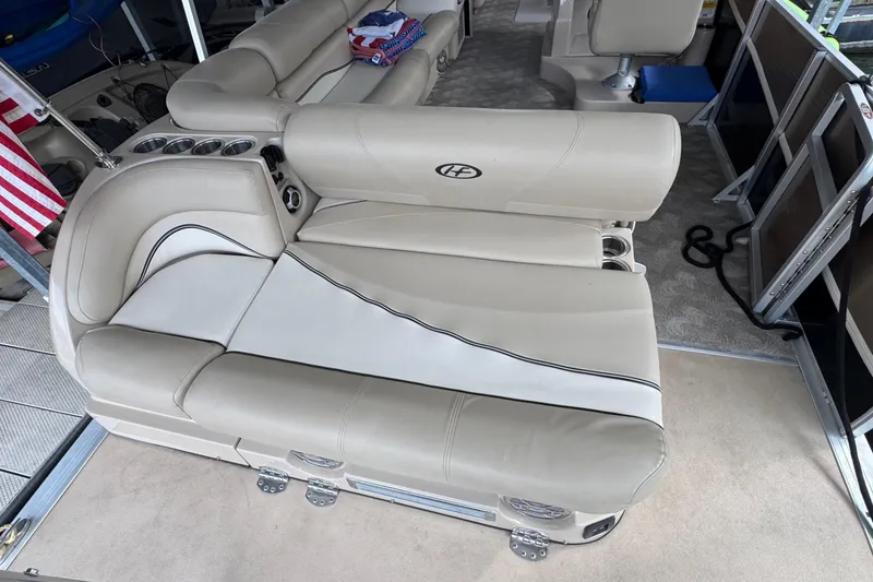 Slide: The Image of Luxurious seating on a 2010 Harris Grand Mariner 250 pontoon boat with cup holders. - 21