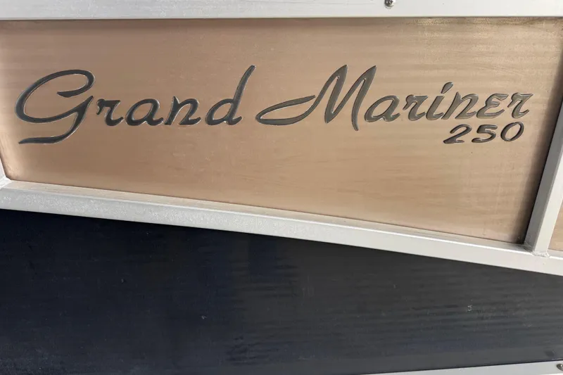 Slide: The Image of 2010 Harris Grand Mariner 250 logo on boat panel. - 26