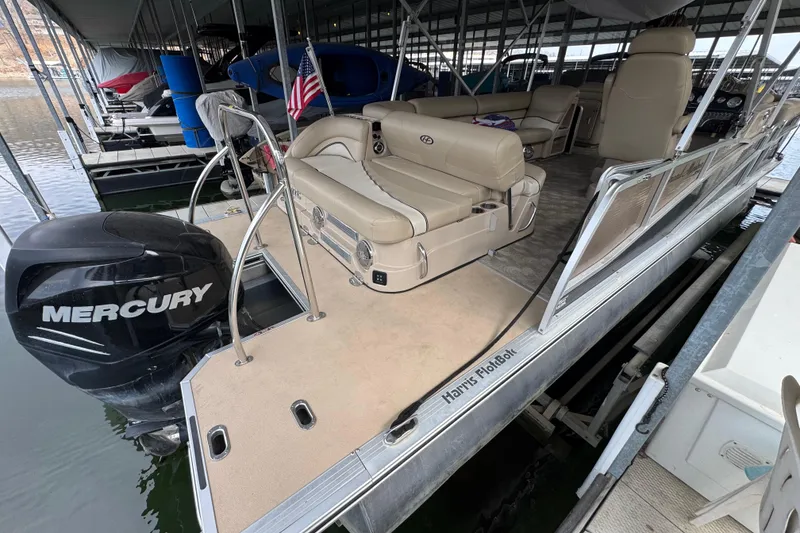 Slide: The Image of 2010 Harris Grand Mariner 250 pontoon boat with Mercury engine, docked in marina. - 5