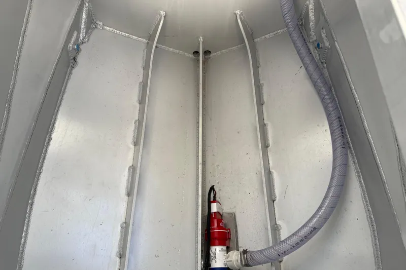 Slide: The Image of Interior view of Makaira Gen3 26 Outboard 2026 boat hull with fire extinguisher and hose. - 42