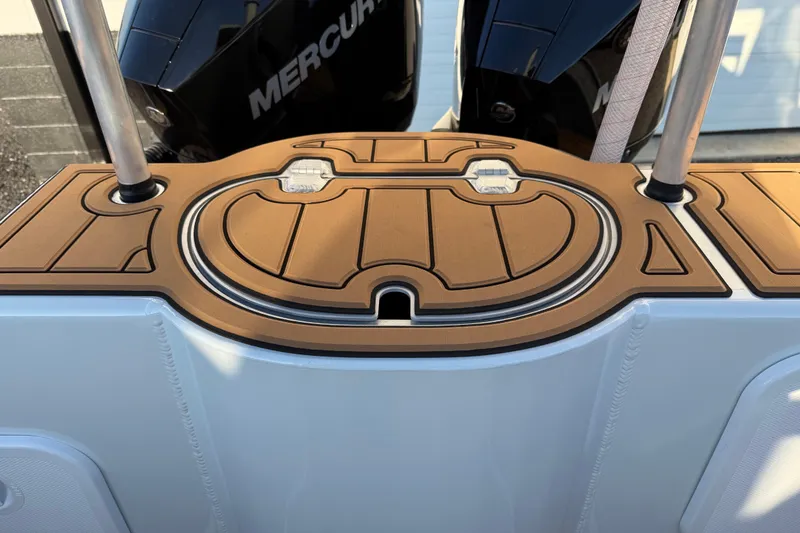 Slide: The Image of 2026 Makaira Gen3 26 Outboard boat deck with dual Mercury engines. - 43