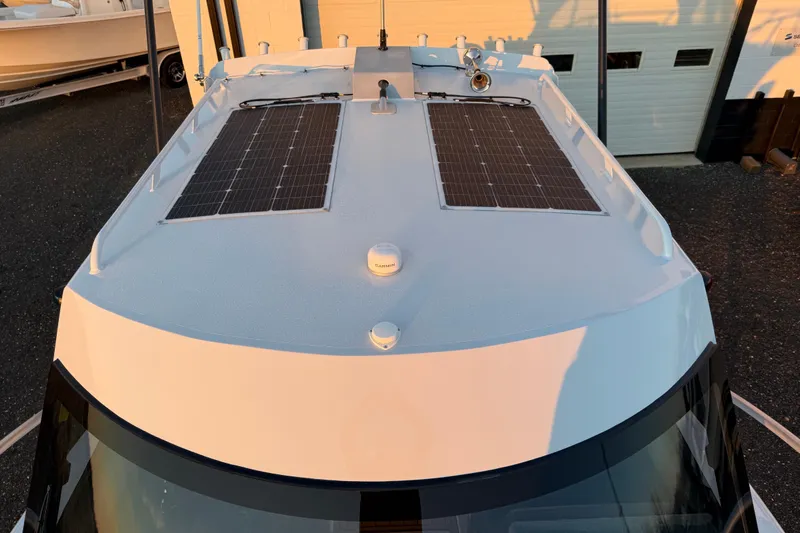 Slide: The Image of 2026 Makaira Gen3 26 Outboard boat with solar panels on the roof. - 49