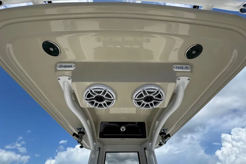 Slide: The Image of 2025 Blackwater 23 Bay boat roof with speakers and lights against blue sky. - 33