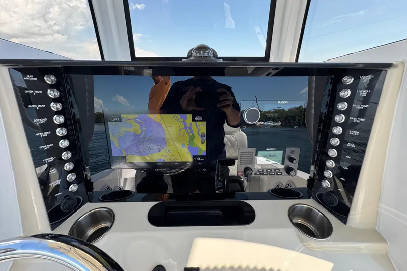 Slide: The Image of Control panel of 2025 Blackwater 23 Bay boat with navigation display and controls. - 40