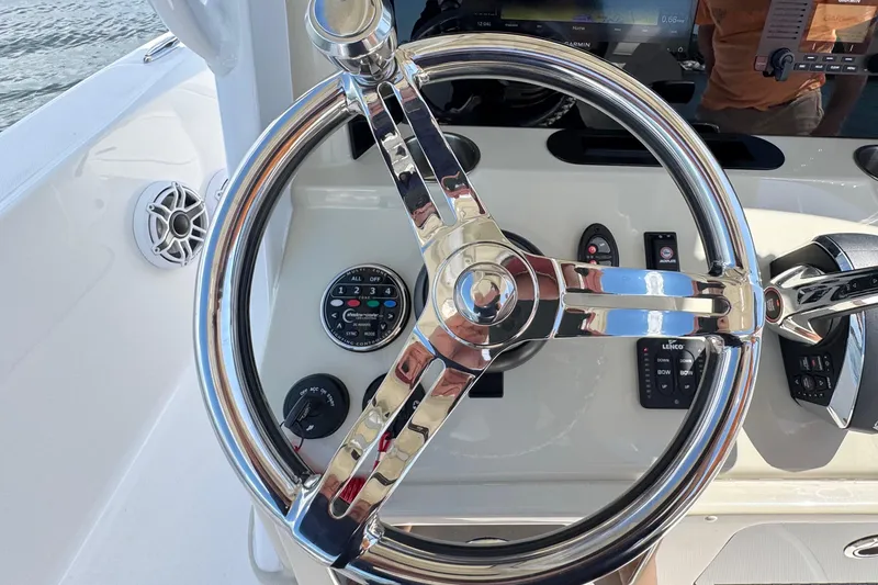 Slide: The Image of Steering wheel and controls of 2025 Blackwater 23 Bay boat. - 44