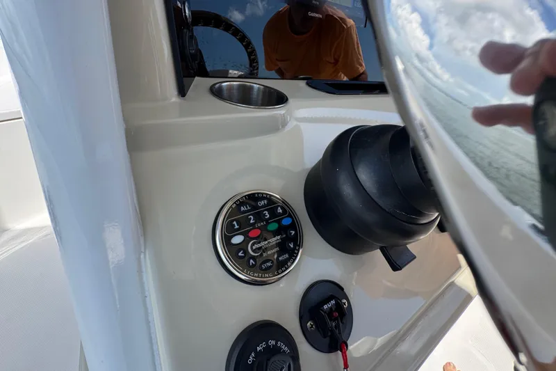 Slide: The Image of Control panel of 2025 Blackwater 23 Bay boat with various switches and dials. - 45