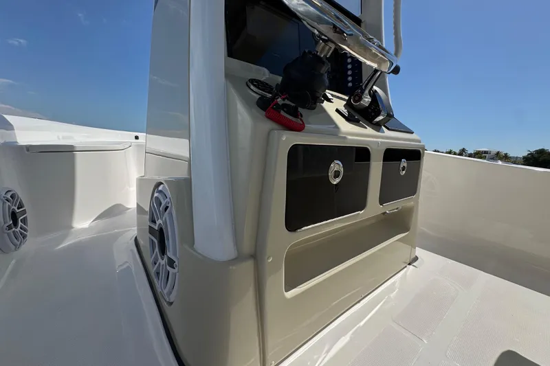 Slide: The Image of 2025 Blackwater 23 Bay boat console with speakers and storage compartments. - 46
