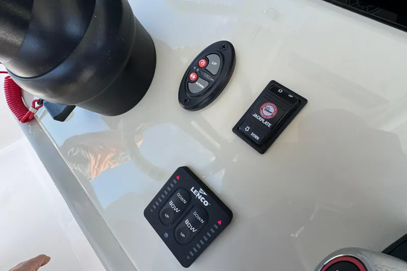 Slide: The Image of Control panel of 2025 Blackwater 23 Bay boat with various switches and buttons. - 48