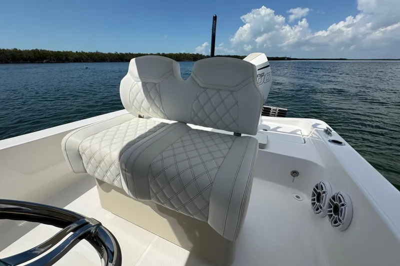 Slide: The Image of 2025 Blackwater 23 Bay boat with luxurious seating on calm waters. - 53