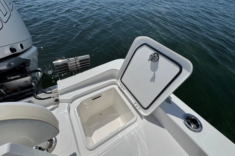 Slide: The Image of Open storage compartment on 2025 Blackwater 23 Bay boat, near water surface. - 62