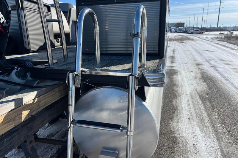 Slide: The Image of 2024 Qwest 8520 DH RLS LT boat with ladder on snowy dock. - 14