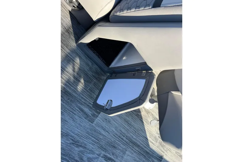 Slide: The Image of Open storage compartment in 2024 Qwest 8520 DH RLS LT boat interior. - 18