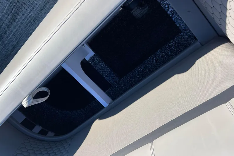 Slide: The Image of Interior view of 2024 Qwest 8520 DH RLS LT boat seating area. - 20