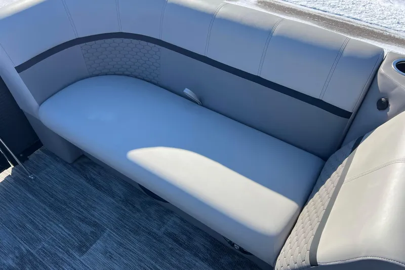 Slide: The Image of Luxurious seating on 2024 Qwest 8520 DH RLS LT boat, featuring sleek gray upholstery. - 21