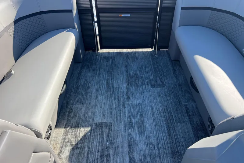 Slide: The Image of 2024 Qwest 8520 DH RLS LT boat interior with gray seating and textured flooring. - 23