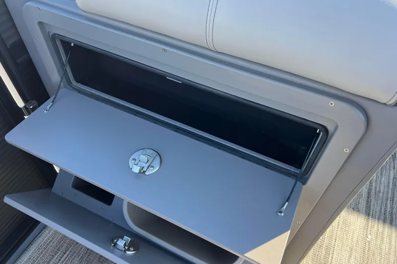 Slide: The Image of Open storage compartment on 2024 Qwest 8520 DH RLS LT boat. - 25