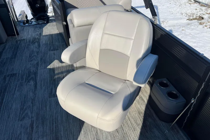 Slide: The Image of Luxurious seating on 2024 Qwest 8520 DH RLS LT boat with cup holders. - 28