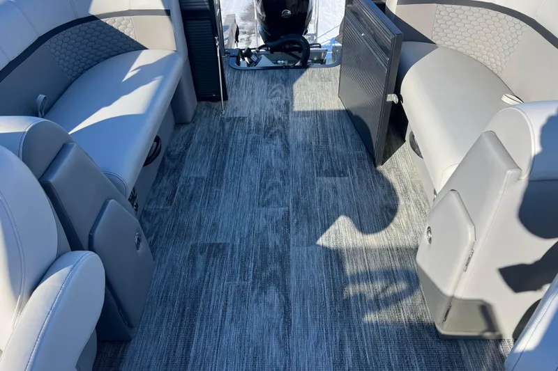 Slide: The Image of 2024 Qwest 8520 DH RLS LT boat interior with gray seating and flooring. - 29