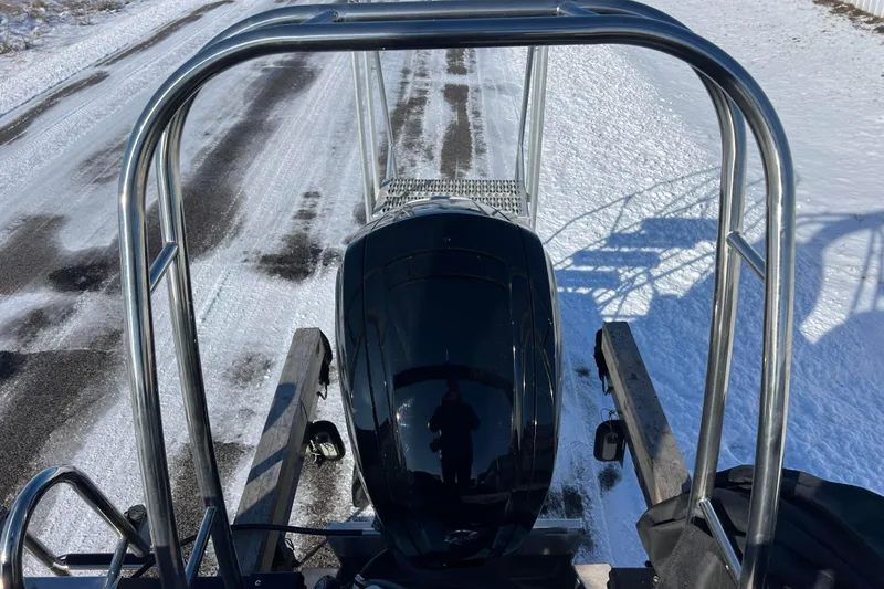 Slide: The Image of 2024 Qwest 8520 DH RLS LT boat on snowy road, rear view. - 32