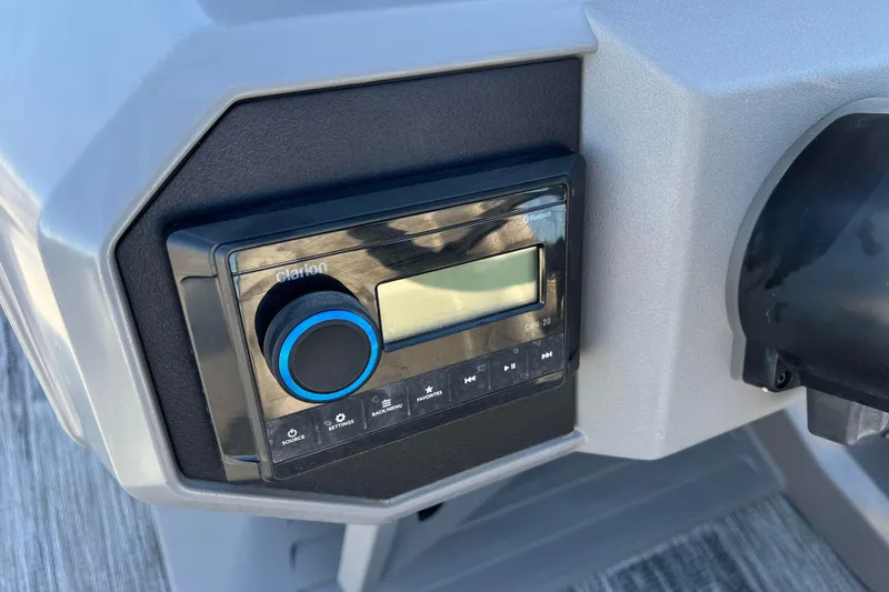 Slide: The Image of 2024 Qwest 8520 DH RLS LT boat dashboard with Clarion audio system. - 36