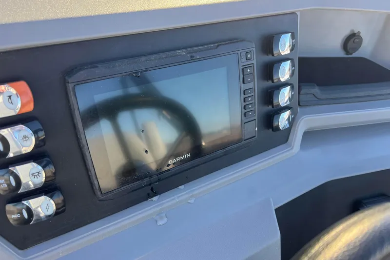 Slide: The Image of Control panel of 2024 Qwest 8520 DH RLS LT with Garmin display and switches. - 37