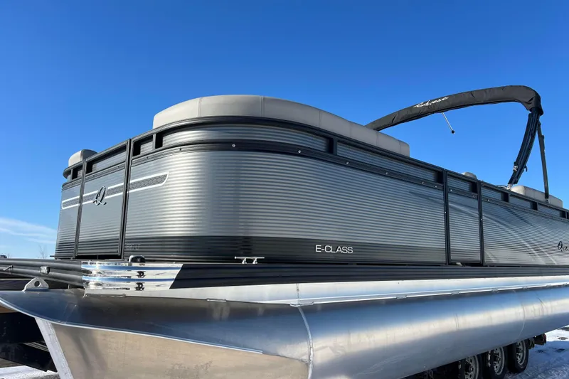 Slide: The Image of 2024 Qwest 8520 DH RLS LT pontoon boat under clear blue sky. - 7