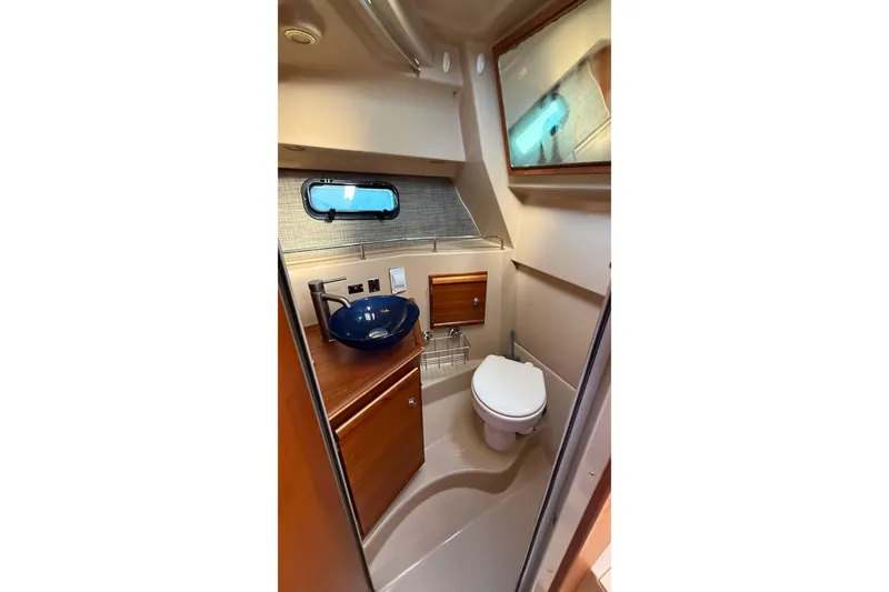 Slide: The Image of 2019 Ranger Tugs R-27 boat bathroom with modern sink and toilet. - 22