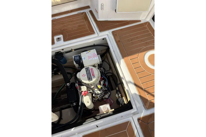 Slide: The Image of Engine compartment of 2019 Ranger Tugs R-27 boat with visible components and wiring. - 5