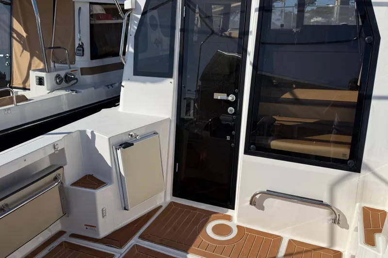 Slide: The Image of 2019 Ranger Tugs R-27 boat interior with sleek design and modern amenities. - 6
