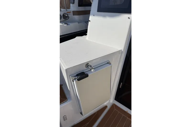 Slide: The Image of 2019 Ranger Tugs R-27 boat interior with compact storage compartment. - 7