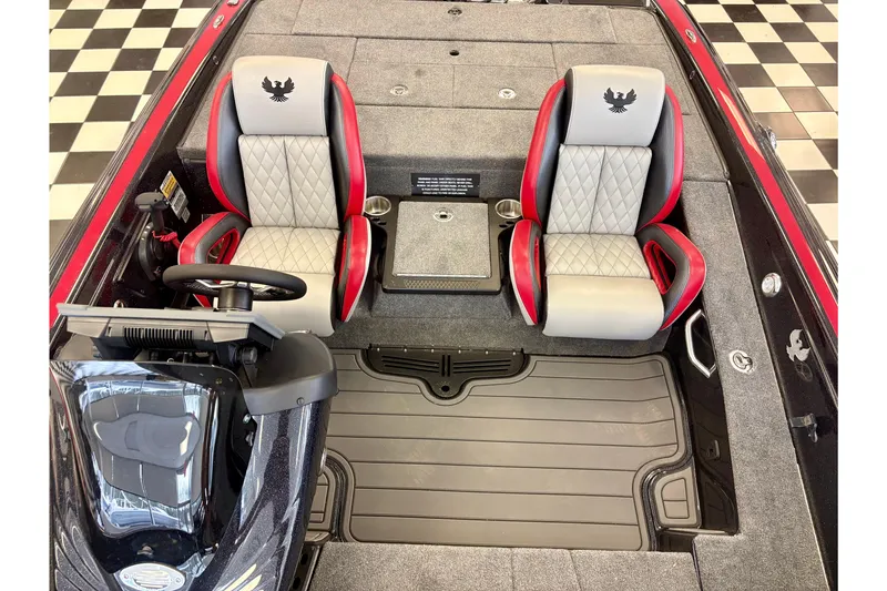 Slide: The Image of 2026 Phoenix 819 ZXL boat interior with dual seats, red accents, and steering console. - 10