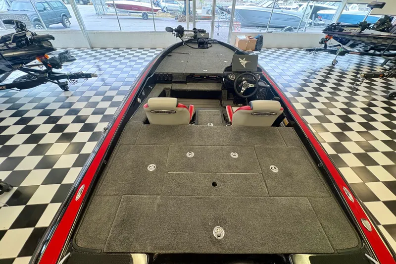 Slide: The Image of 2026 Phoenix 819 ZXL boat interior with checkered floor showroom display. - 14