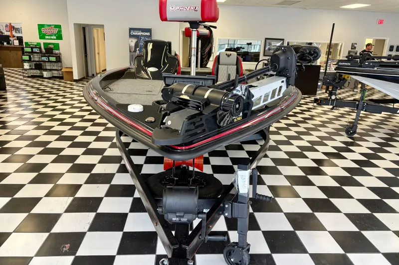 Slide: The Image of 2026 Phoenix 819 ZXL boat displayed in showroom with checkered floor. - 5