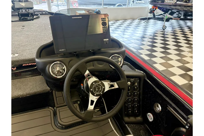 Slide: The Image of 2026 Phoenix 819 ZXL boat dashboard with steering wheel and electronic display. - 9