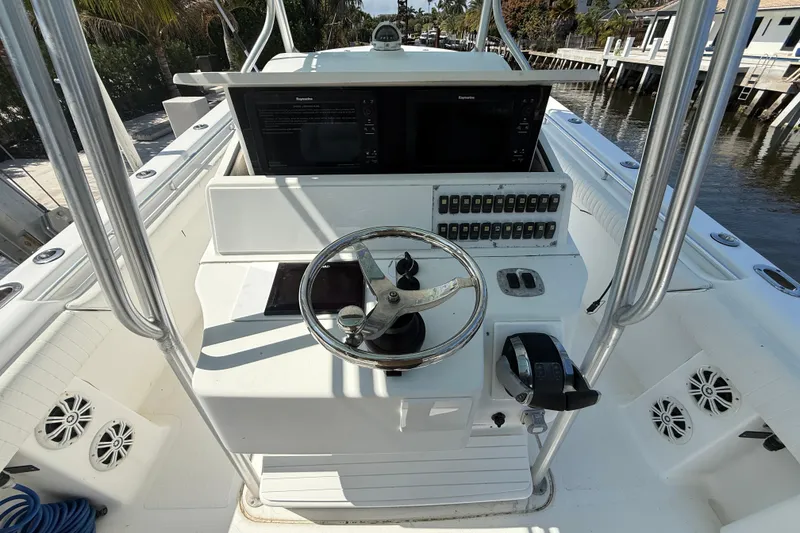 Slide: The Image of Steering console of 2003 Palmetto 33 Adventure boat with controls and navigation screens. - 8